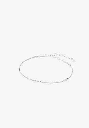 Bracelet délicat en argent avec de petites perles rondes espacées le long d'une fine chaîne et un fermoir ajustable avec des maillons d'extension.