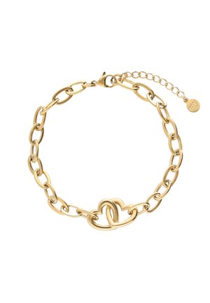 Bracelet en chaîne dorée avec des maillons ovales entrelacés et un élément central en forme de cœur, doté d'un fermoir à ressort et d'une chaînette extensible.