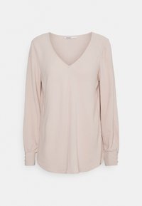 Langärmlige, blass rosa Bluse mit V-Ausschnitt, leicht lockerer Passform und geknöpften Ärmelbündchen. Weiche Textur, glattes Material und keine sichtbaren Muster.