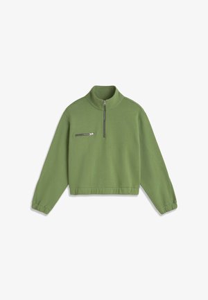 Pull-over vert à manches longues avec col montant, demi-fermeture éclair à l'avant, poche poitrine zippée, poignets et taille élastiques.