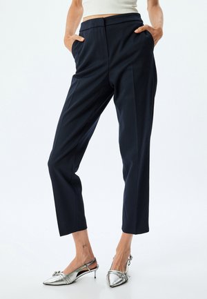 CIGARETTE PANTS - Housut - black
