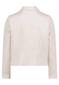 Ljusbeige, kort jacka med spetshals, långa ärmar och subtil sömnadsdetaljering på ryggen. Slätt, strukturerat tyg.