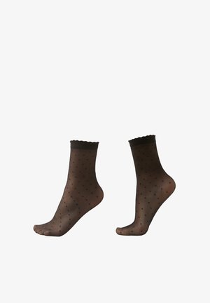 Schwarze Pünktchen-Servic Socken mit transparentem Material und gewelltem oberen Rand. Verfügt über kleine schwarze Punkte, die gleichmäßig verteilt sind.