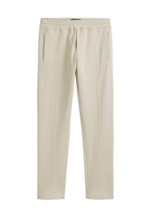 Beige joggerbroeken van zachte stof, met een elastische tailleband, zijzakken en een slim fit ontwerp met subtiele stikdetails.