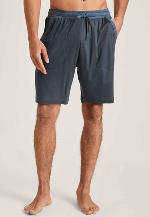 Mannen navy sportshorts van lichtgewicht stof, met een elastische tailleband, trekkoord en zijzakken voor gemak.
