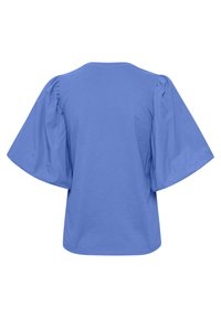 Blå topp med breda, voluminösa puffärmar och rund halsringning, visad bakifrån mot en vit bakgrund.