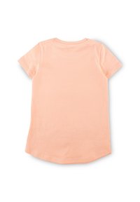 Light peach short-sleeve t-shirt, round neckline, soft cotton material, curved hem at the bottom, smooth texture, no patterns or accents.