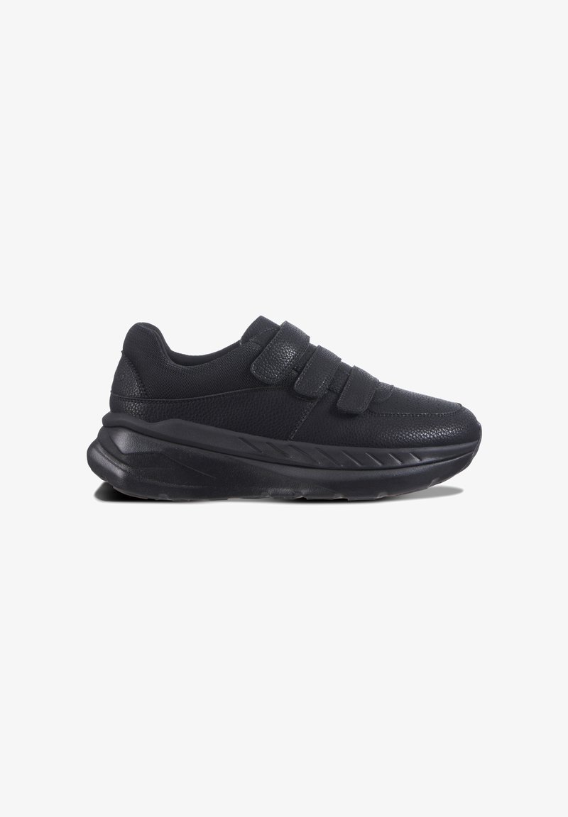 Svart sneaker med två kardborreband, övre del av texturerat tyg, vadderad krage och en kraftig gummisula med ett zigzag-mönster.