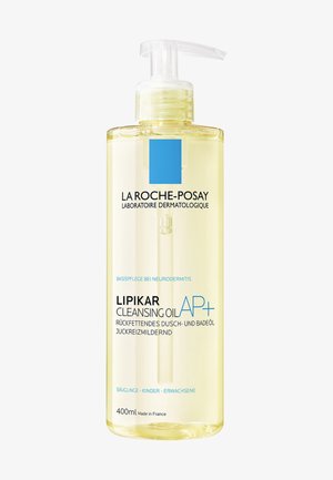 Clear plastic bottle with a pump dispenser, containing yellow cleansing oil. Label features blue accents and black text, 400ml capacity.