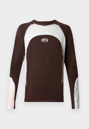 Koszula z długim rękawem w ciemnobrązowym kolorze z jasnoszarymi siateczkowymi akcentami. Posiada okrągły dekolt i logo na piersi. Materiał to mieszanka bawełny.