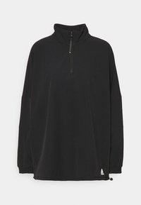 Sort pullover-top lavet af blødt materiale, med høj krave, kvart lynlås, lange ærmer og snor i kanten. Ikonisk logo på bunden.