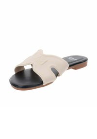 Sandal beige con design a strappo moldato, soletta nera e suola marrone chiaro. Presenta ritagli per la ventilazione.