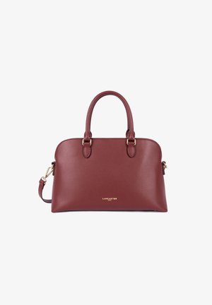 Burgundy leather handbag with two top handles, a detachable shoulder strap, gold hardware, and a textured surface. Features brand logo on front.