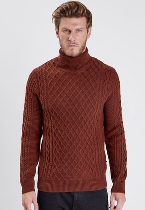 Brown knitted turtleneck sweater featuring a textured diamond pattern with cable accents. Long sleeves and ribbed cuffs and hem.