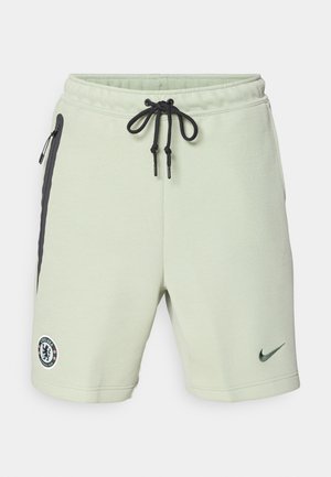 Calções de sweat verde claro com detalhes em preto, cintura com cordão, bolsos laterais e logótipo bordado do Chelsea FC. Feitos de tecido suave.