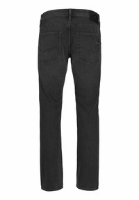 Svarta denimjeans visade från baksidan, med två bakfickor och bältesloopar i midjan.