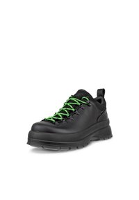 Chaussures de randonnée en cuir noir avec des lacets verts, dotées d'une semelle robuste, d'un col rembourré et d'une languette pour faciliter l'enfilage.