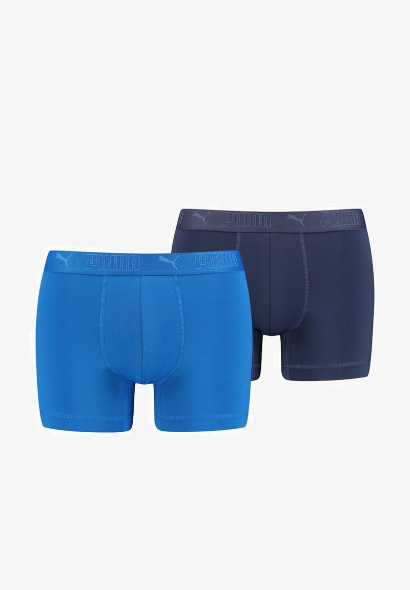 PUMA men’s boxer briefs in blue and navy. Stretch fabric, elastic waistband with logo, double-stitch seams, and smooth texture.