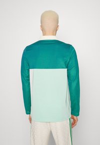 adidas Originals ADICOLOR 70S - Long sleeved top - green
