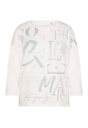 White relaxed-fit long-sleeve shirt featuring various gray text phrases, a round neckline, and a soft texture. Includes metallic accents.