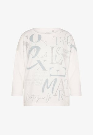White relaxed-fit long-sleeve shirt featuring various gray text phrases, a round neckline, and a soft texture. Includes metallic accents.