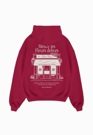 Bordeaux hoodie met een grafische print van een bloemenwinkel, witte tekst en een gedetailleerde illustratie van de winkel en bloemenarrangementen.