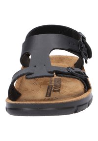 Schwarze Sandale mit einer glatten Oberseite, zwei verstellbaren Riemen, einer konturierten Korkfußbett und einer strukturierten Gummisohle.