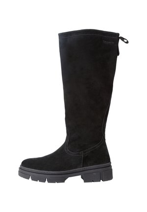 Botte noire en suède montant jusqu'au genou avec semelle épaisse crantée et languette à l'arrière, vue de profil sur fond blanc.