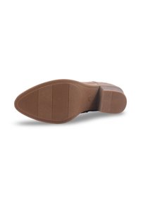 Semelle en caoutchouc marron avec des motifs texturés, dotée de rainures horizontales et verticales pour une meilleure adhérence et stabilité.