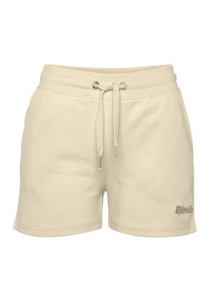 Cream-colored cotton shorts with an elastic waistband, drawstring closure, and a small logo detail on the lower side.