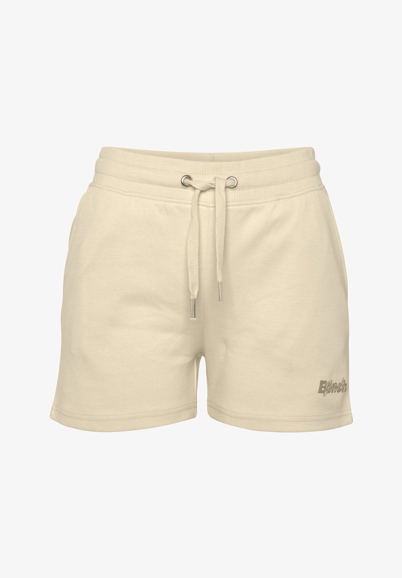 Cream-colored cotton shorts with an elastic waistband, drawstring closure, and a small logo detail on the lower side.