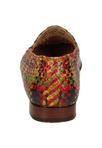 Woven multicolored slip-on shoe with a rounded back. Materials include leather-like texture, featuring red, green, gold, and navy blue hues.