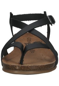 Sandalias negras con correas cruzadas, plantilla de corcho y suela plana. Correa ajustable en el tobillo con hebilla. Talla 37 indicada en la plantilla.