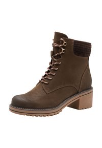 Bottines en cuir marron avec un talon épais, bout arrondi et lacets à l'avant. Accents en tissu marron côtelé autour du col. Semelle en caoutchouc.