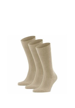 Drei Paar beige, knöchellange Socken, die aufrecht vor einem weißen Hintergrund stehen.