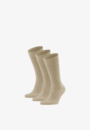 Drei Paar beige, knöchellange Socken, die aufrecht vor einem weißen Hintergrund stehen.