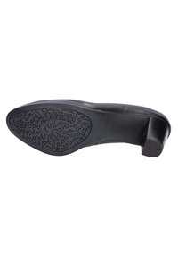 Black leather shoe with a round toe, low block heel, and a textured rubber sole featuring a curved pattern for grip.