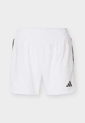 Shorts de sport blancs avec taille élastique, bandes latérales noires, et logo Adidas noir sur la partie inférieure de la jambe droite.