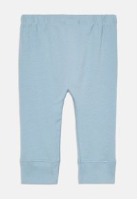 Lichtblauwe katoenen leggings met een zachte textuur, elastische tailleband en omslagmanchetten, met een eenvoudig en onopgesmukt ontwerp.