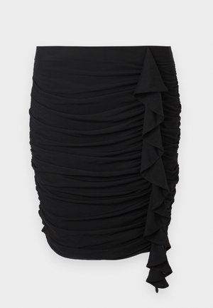 Musta rypytetty hame, jossa on liehuke yksityiskohtana sivussa, valmistettu joustavasta kankaasta ja muotoonompelusta siluetista.