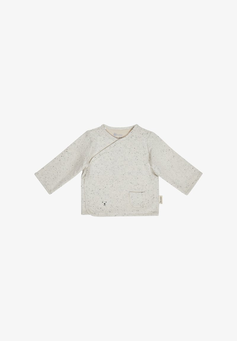 Chemise cache-cœur bébé manches longues crème mouchetée, boutons-pression diagonaux, petite poche devant et subtil détail visage d’ours près de l’ourlet.