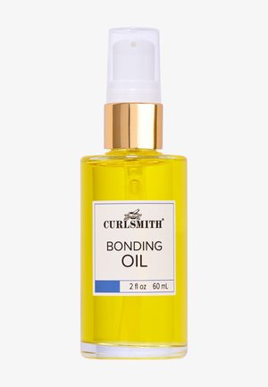 Curlsmith Bonding Oil in a clear 60 mL bottle. The liquid is a bright yellow color. Features a gold cap and a white label with black text.