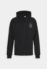 Veste à capuche noire zippée avec le logo du Los Angeles Football Club sur la poitrine et un logo Adidas discret de l'autre côté.