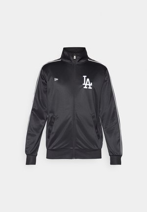 Black athletic jacket made of satin with a high collar, full front zipper, white LA logo, and white side stripes along the sleeves.