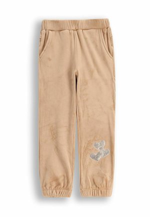 Beżowe, miękkie spodnie z polaru z elastycznym pasem, kieszeniami po bokach oraz wzorem srebrnych balonów w kształcie serca na lewej nodze.