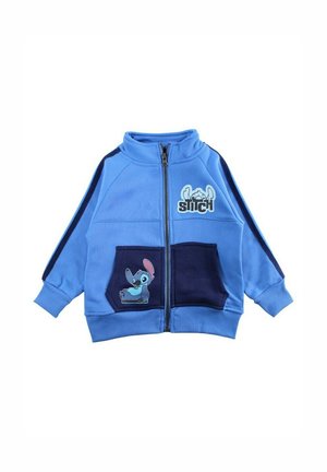 Veste à fermeture éclair bleue pour enfants avec poches bleu marine, rayures bleu marine sur les manches et images du personnage Stitch sur la poitrine et la poche.