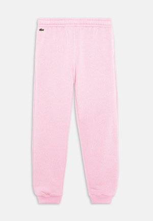 Pantalon de jogging rose en tissu doux, avec une taille élastique confortable, des poignets fuselés et un petit logo sur le côté.