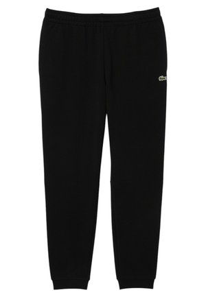 Pantaloni della tuta neri realizzati in morbido tessuto, dotati di vita elasticizzata, caviglie a costine e un piccolo logo verde sul fianco sinistro.