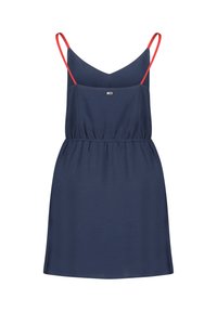 Ärmlös marinblå klänning med röda spaghetti-remmar, elastisk midja, V-ringning och en subtil varumärkeslogotyp framtill. Lättviktig tyg.