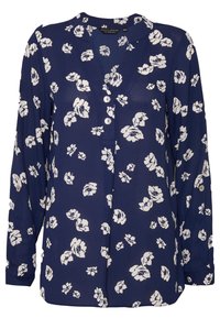 Námořnická modrá blůza s bílým květinovým vzorem, dlouhé rukávy a zapínání na knoflíky. Měkká, lehká tkanina s volným střihem.